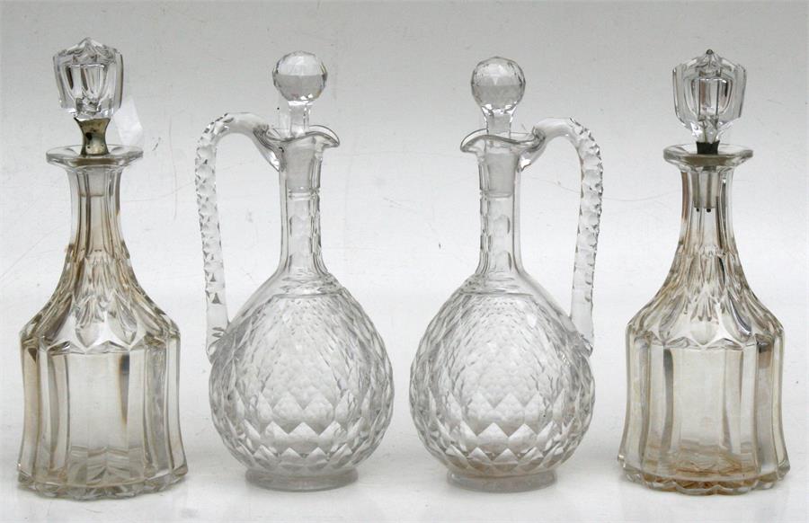 Two pairs of Victorian cut glass decanters. Condition Report Minor nicks to stoppers of central
