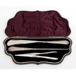 A Victorian cased silver handled three-piece dressing table set comprising a button hook, shoe