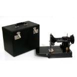 A Singer Featherweight portable sewing machine, model 221K, cased.