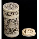 A 19th century Chinese Canton Export carved ivory roundel, deeply carved with figures, 5cms (2ins)