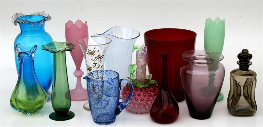 A quantity of Victorian and later Art glass vases and jugs.