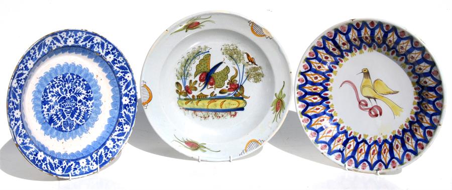 Three faience pottery chargers, the largest 35cms (13.75ins) diameter (3).