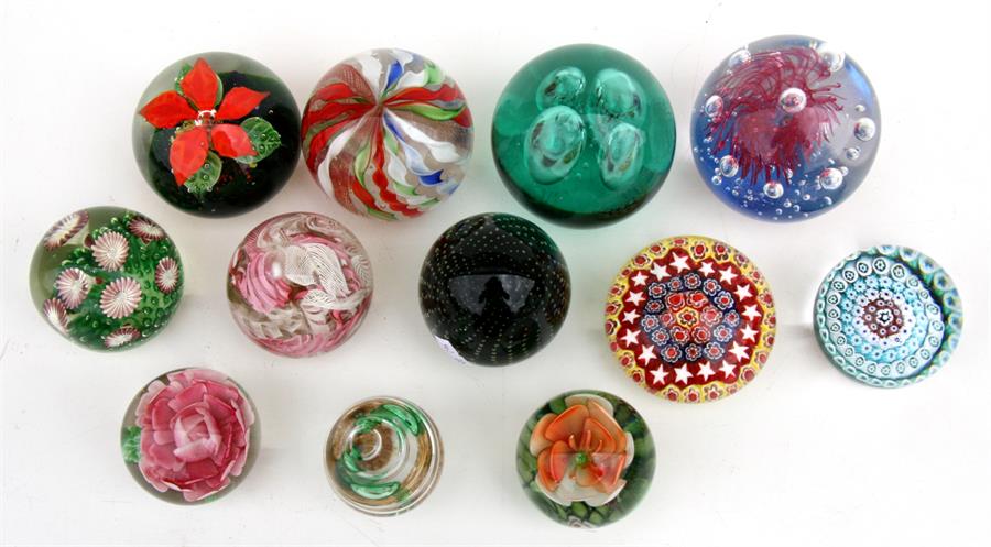 A quantity of glass paperweights to include millefiori and latticino (12).