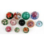 A quantity of glass paperweights to include millefiori and latticino (12).