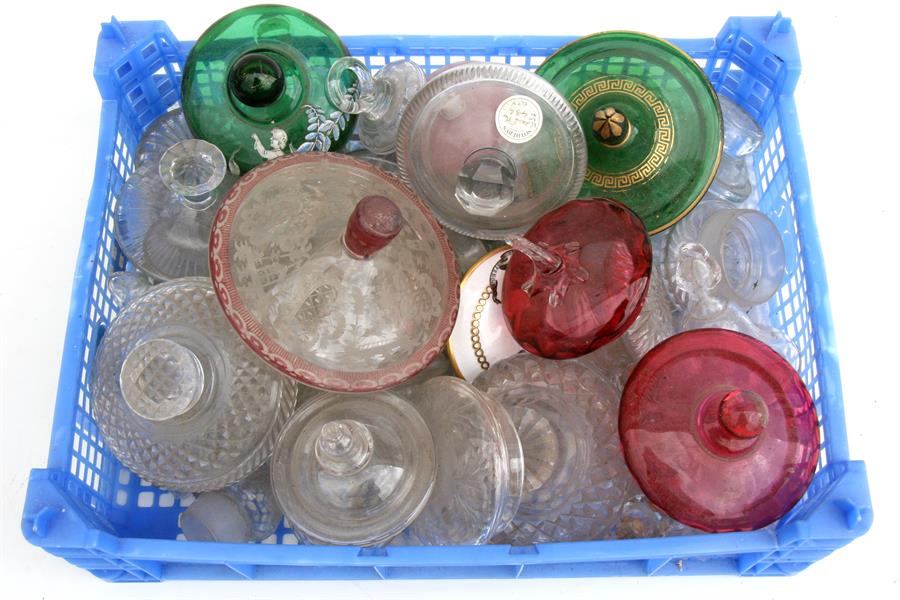 A large quantity of Victorian glass jar covers.