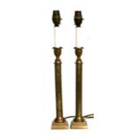 A pair of brass table lamps, 38cms (15ins) high.