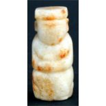 A Chinese jade figural toggle with russet inclusions possibly Han dynasty. 5cm (2ins) high