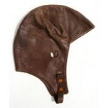 A vintage brown leather flying or driving helmet