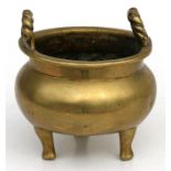 A Chinese censer with two rope twist handles standing on three legs. 9cm (3.5ins) diameter