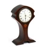 An Art Nouveau mantle clock, the white enamel dial with Roman numerals, in an inlaid mahogany