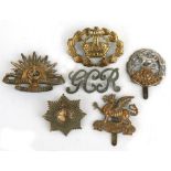 A group of military cap badges, to include the Hampshire Regiment, the Buffs and Australian