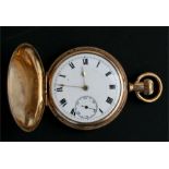 A gold plated hunter pocket watch, the white enamel dial with Roman numerals and subsidiary seconds,