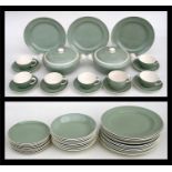 A Poole Pottery green twintone part dinner service.