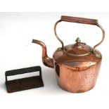 A Victorian copper kettle; together with a 'Kiwi Cooker' cast iron meat press (2).