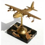 A brass model of a WW2 Sunderland Flying Boat on a marble stand. Wingspan 20cms (8ins) by 16cms (6.