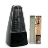 A Beyer metronome; together with a Maelzel Paquet pocket metronome (2).