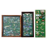 A private collection of approximately 250 Airline and Aviation badges mounted on three display