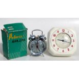A Smith's 8-day Bakelite kitchen clock; together with a Polaris alarm clock, boxed, (2).