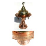 A Turkish copper & brass brazier with script to outer rim dating it to 1818, 76cms (13ins) high.