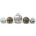 A Chinese ginger jar, decorated with figures in a landscape in enamel colours, 20cms (8ins) high;