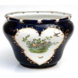 A large Victorian jardiniere decorated with birds on a deep blue ground, 42cms (16.5ins) diameter (