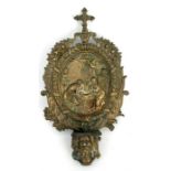 A 19th century bronze holy water font decorated in relief with Christ in the manger, 30cms (11.