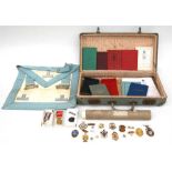 A Masonic case with an apron, books, certificates and a large quantity on Jewels and badges