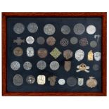 A framed and glazed collection of 38 mainly WW2 badges including 23 Third Reich and 5 Swastika