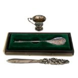 A continental silver letter knife with pierced handle, a silver presentation spoon and a small