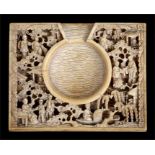 A 19th century Chinese Canton Export carved ivory pocket watch holder deeply carved with figures