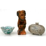 A Chinese glazed temple dog, 20cms (8ins) high; together with a Chinese bowl and a Chinese vase (