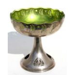 An Art Nouveau silver plated bonbon dish with green glass liner, 19cms (7.5ins) wide.