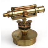 An early 20th century Stanley brass theodolite, numbered 117642, mounted on a brass shell case.