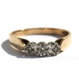 A 9ct gold ring set with three diamonds, approx UK size 'S'.