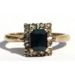 A 9ct gold sapphire & diamond ring, the central square cut sapphire surrounded by diamonds, approx