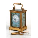 A miniature brass cased carriage clock with painted porcelain panels decorated with birds and