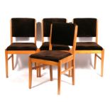 A set of four 1950's Gordon Russell of Broadway dining chairs with upholstered seats and backs (4).