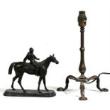 A brass Pullman lamp; together with a spelter figure of a jockey on horseback.