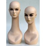 A pair of shop display mannequin heads, the largest 54cms (21.25ins) high (2).