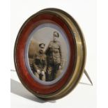 An unusual WW1 trench art photo frame made from the base of a 1917 dated German shell case with an