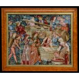 A tapestry picture depicting wine making, in a birds eye maple frame, 47 by 40cms (18.5 by 15.