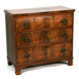 A 19th century figured mahogany chest of three long graduated drawers, on bracket feet, 90cms (35.