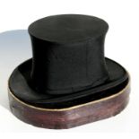 A folding silk top hat in original cardboard carry box.