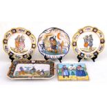 A Quimper rectangular plate decorated with children playing, 39cms (12.25ins) wide; together with