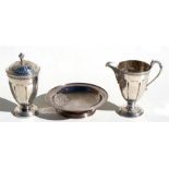 A silver milk jug and matching sugar caster, Birmingham 1935; together with a silver bonbon dish,