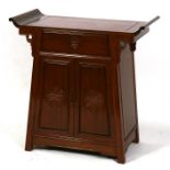 A 20th century Chinese hardwood altar cabinet with single frieze drawer above a cupboard, 79cms (