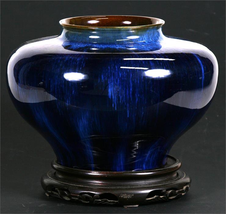 A Denby blue glazed vase of compressed globular form, on an associated pierced hardwood stand, 22cms - Image 2 of 2