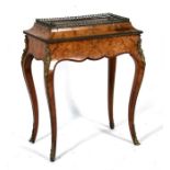 A 19th century Louis XV style marquetry inlaid walnut jardiniere with pierced metal gallery and lead