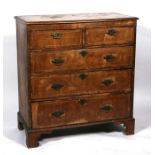 An early 19th century walnut chest of two short & three long graduated drawers, on bracket feet,