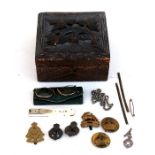 A Black Forest style carved box containing a 19th century ivory quill cutter, a pair of pince nez